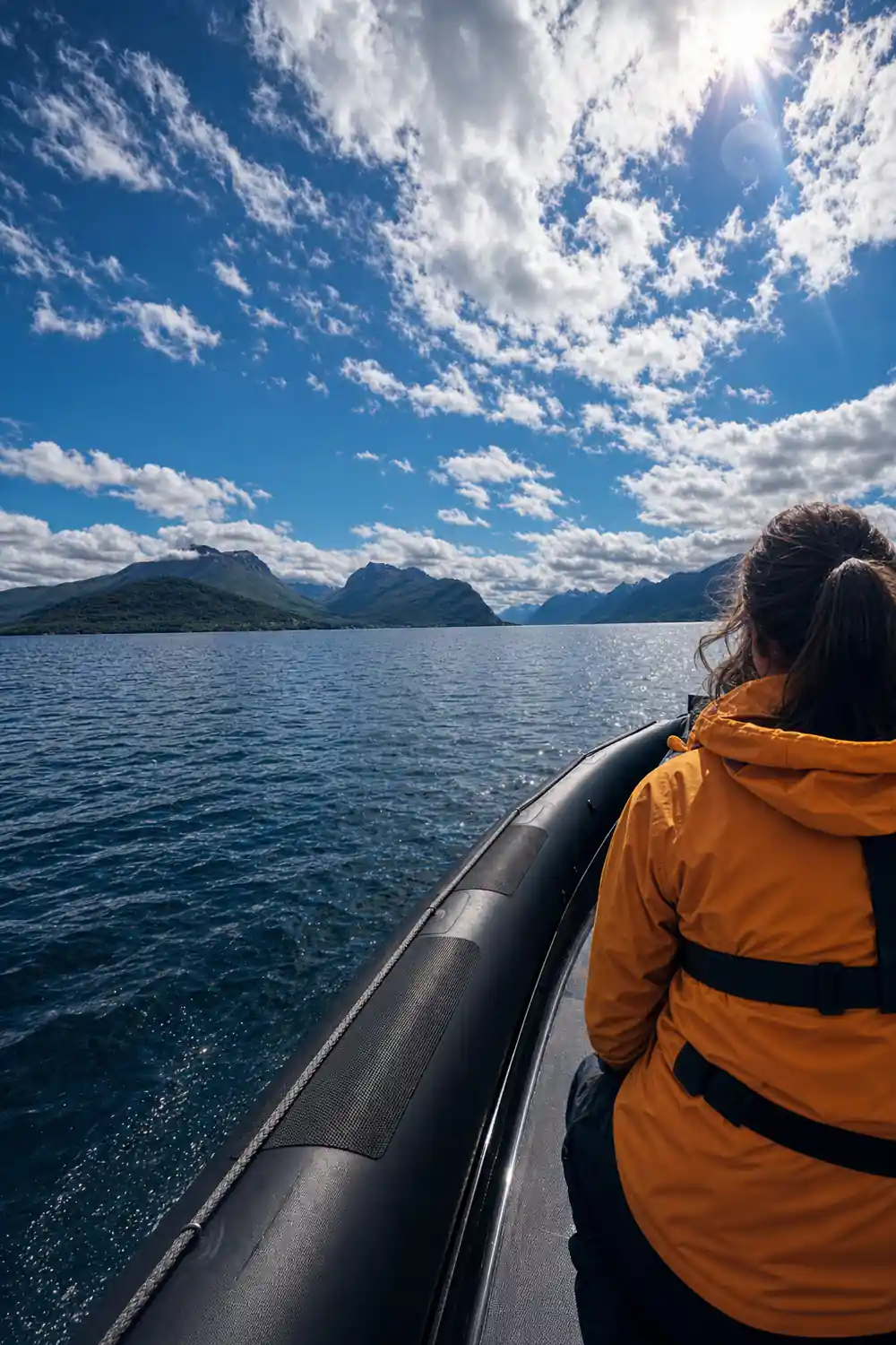The boat's tube and a bright sky over distant peaks