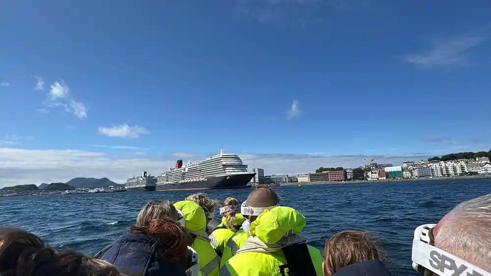 A cruise liner at Alesund seen past passengers aboard