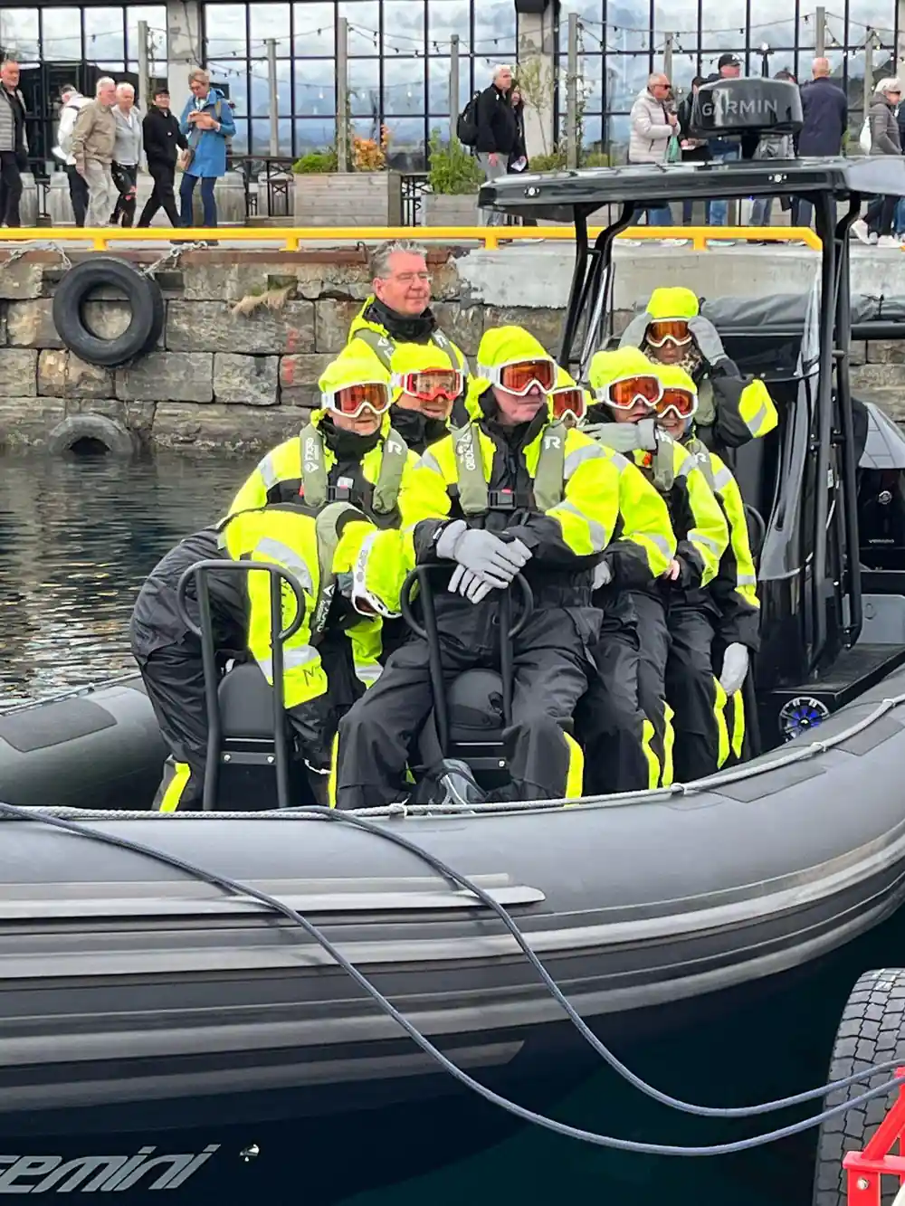 The group seated aboard the RIB at the quay