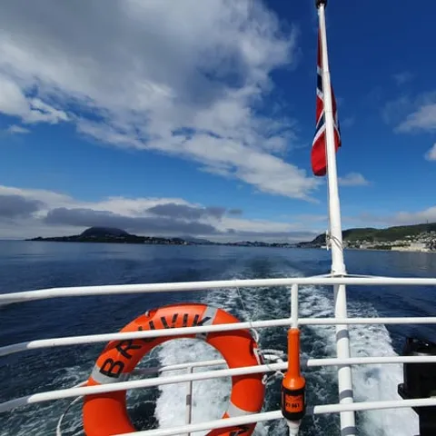 The deck of the classic fjord liner with its lifebuoy