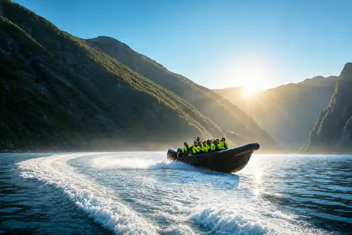 The RIB throwing spray as it turns at speed