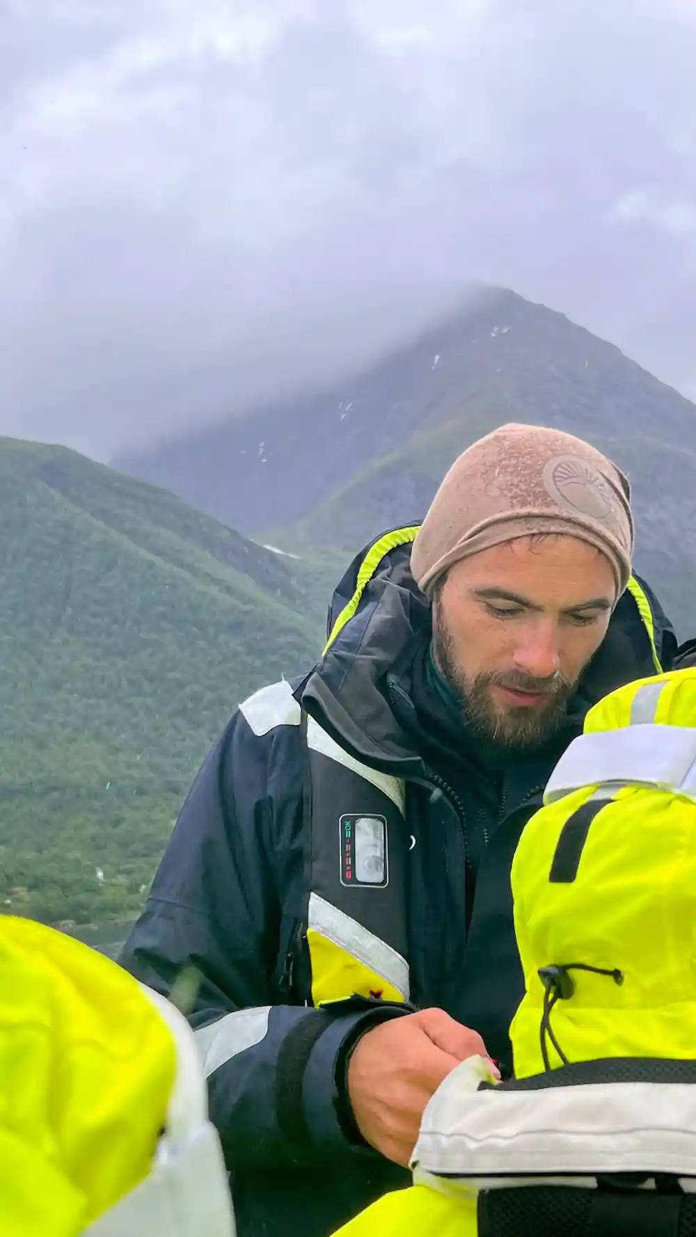 The skipper in a woolly hat at the console